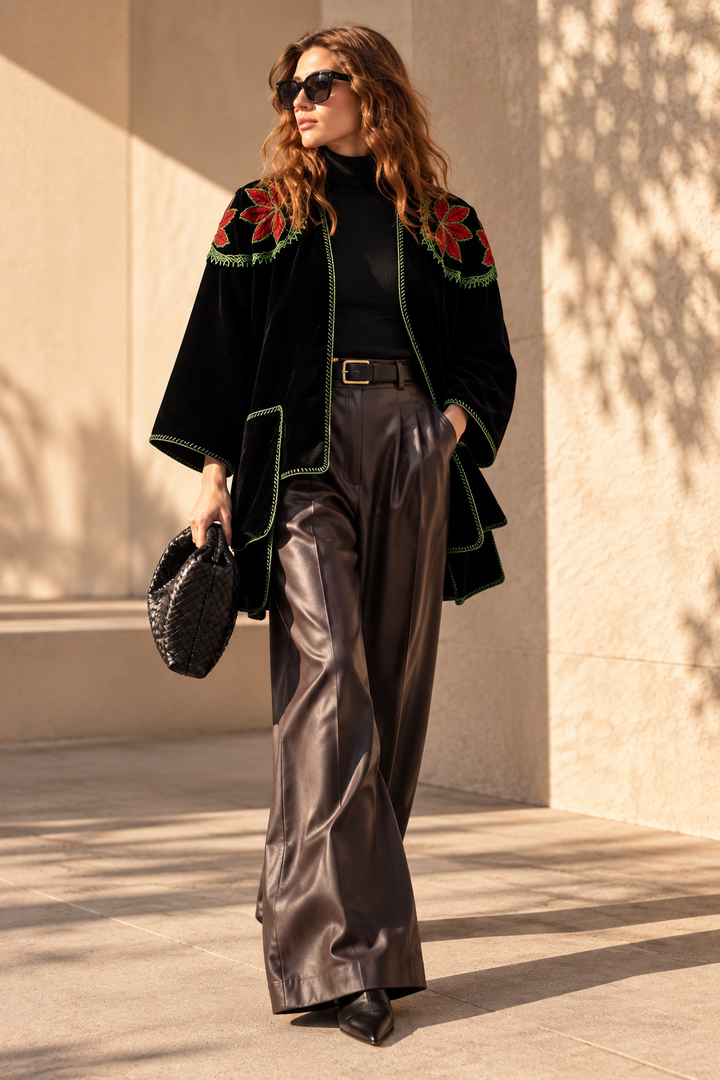 Handcrafted velvet jacket with intricate hand embroidery, styled in a modern fall fashion look.