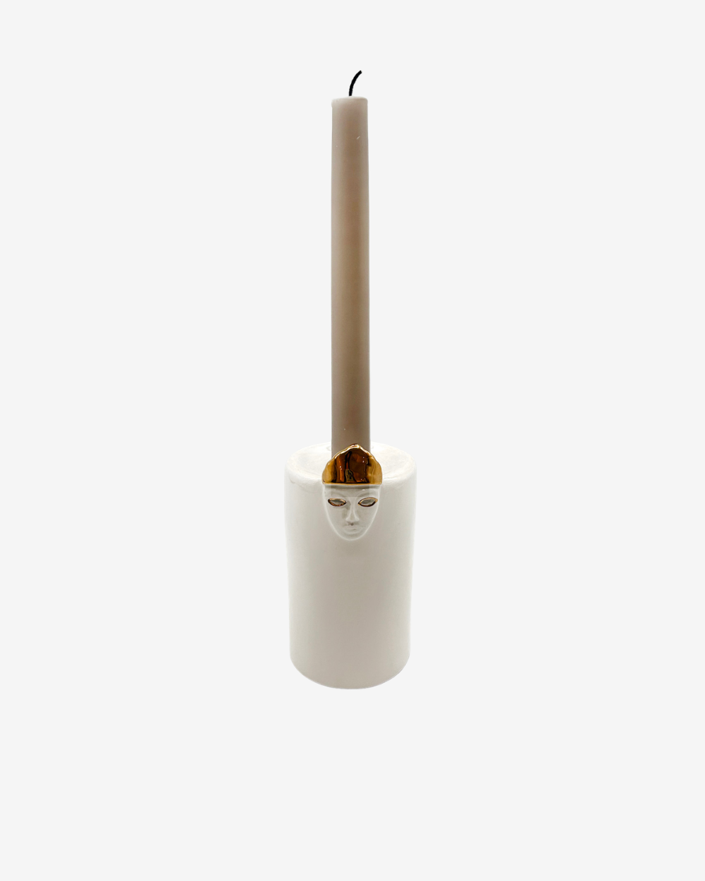 Candle holder with a face design holding a candle on a white background