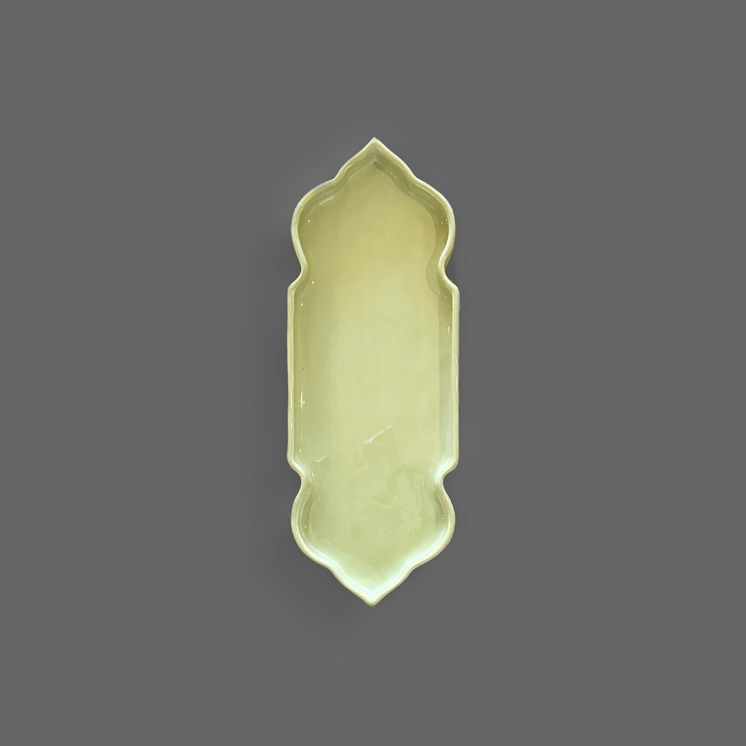 Pastel green handcrafted ceramic serving tray with an elegant sculptural shape