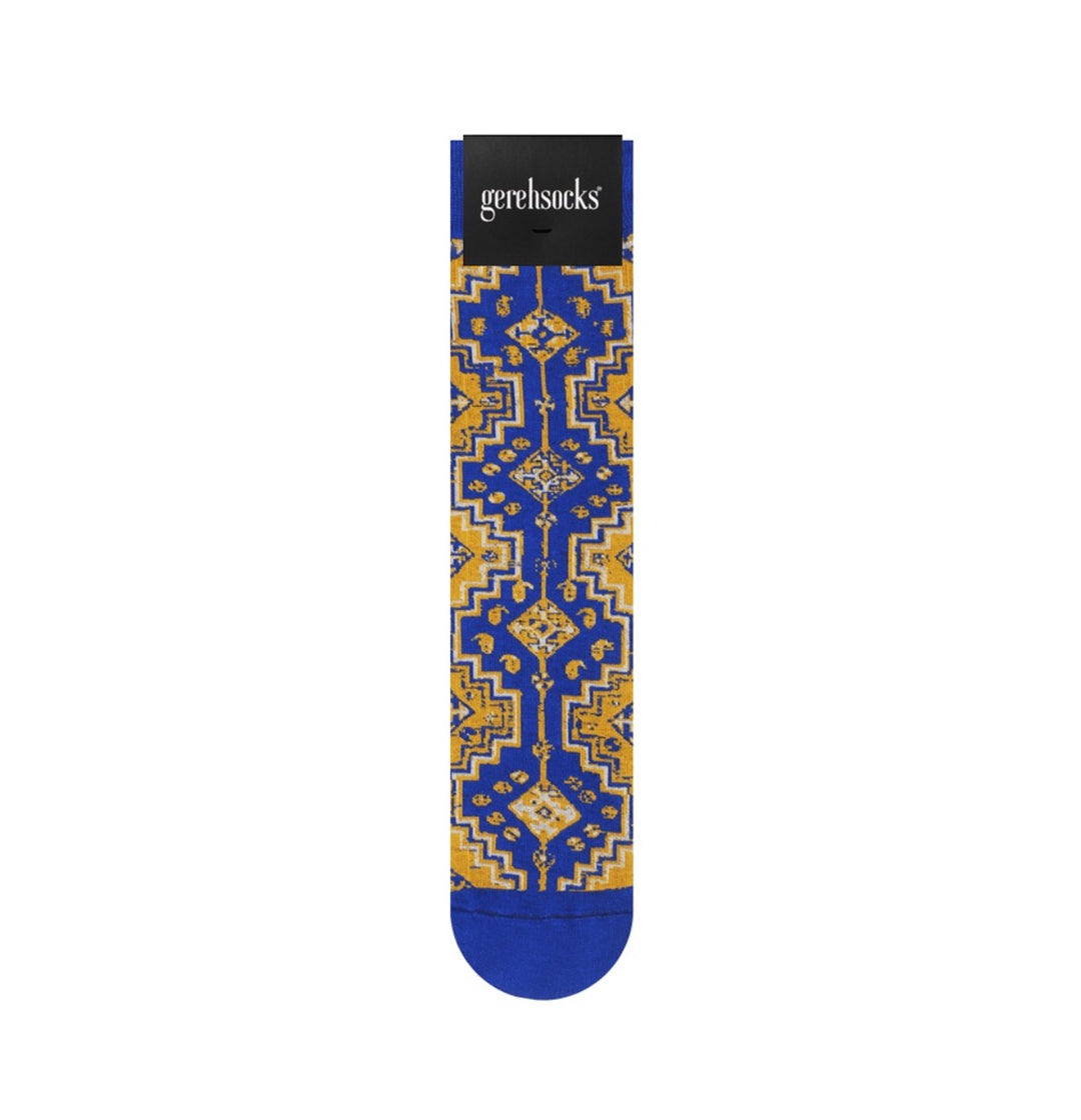 A single blue and gold patterned sock with a black header card displaying the 'gerehsocks' brand, shown against a plain white background.