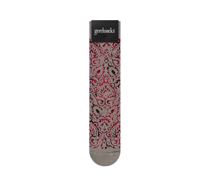 A single sock with a red, black, and gray damask pattern, displayed vertically on a white background with its black paper header card showing the brand 'gerehsucks'.