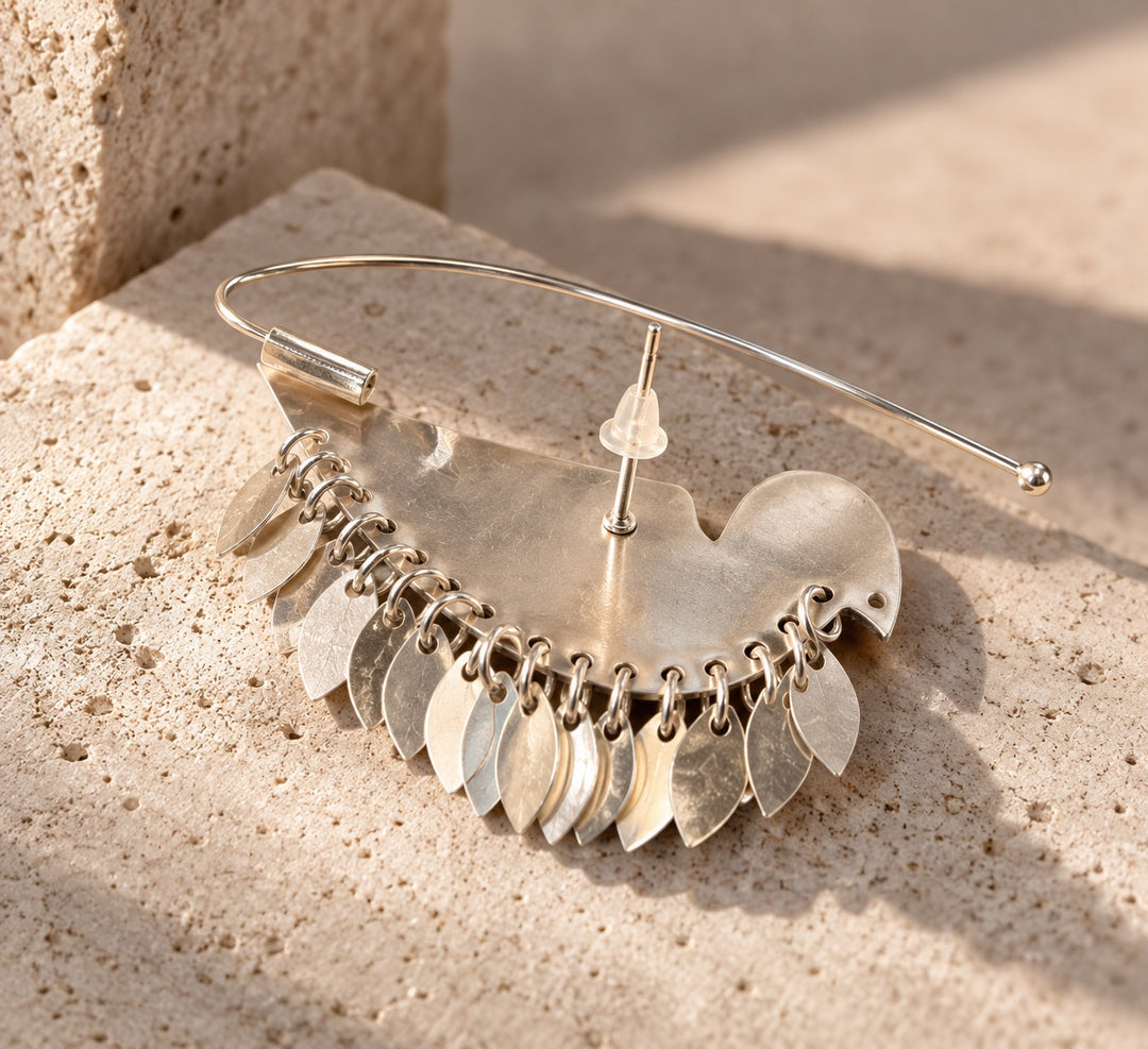Back view of silver bird ear cuff earring showing stud post, curved ear support and dangling details
