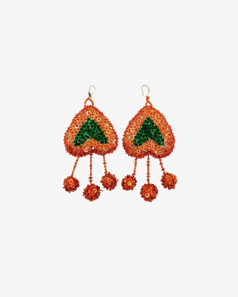Pair of orange and green beaded earrings on a white background
