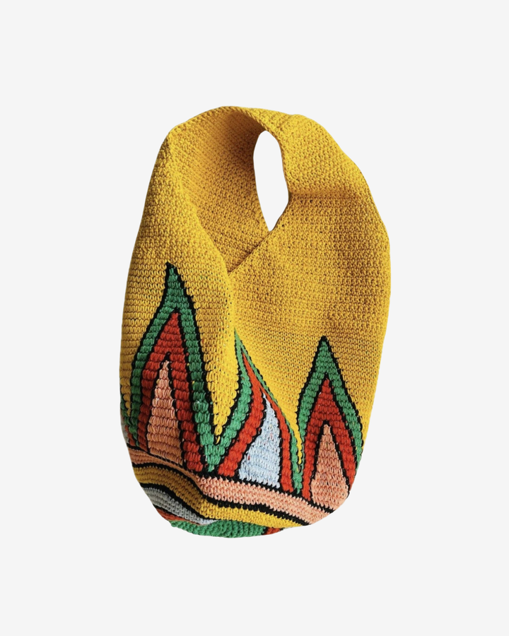 Colorful knitted bag with geometric pattern on a white background